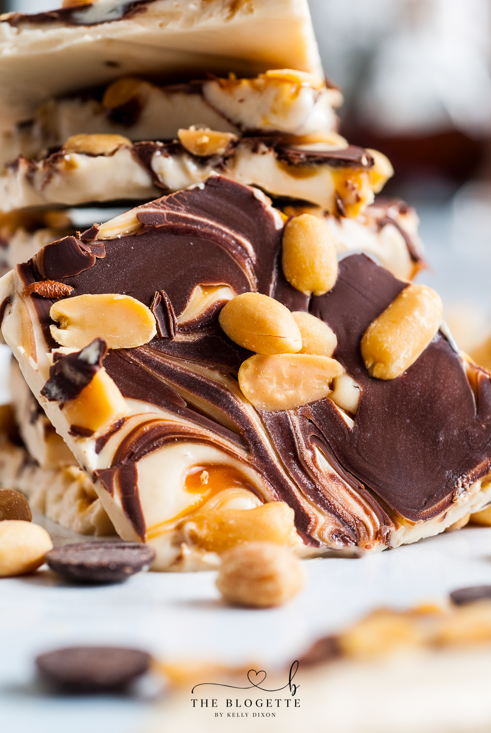 Snickers Frozen Bark is everything you love about the flavors of a Snickers Bar!  Chocolate, caramel, peanuts, and thick frozen yogurt.