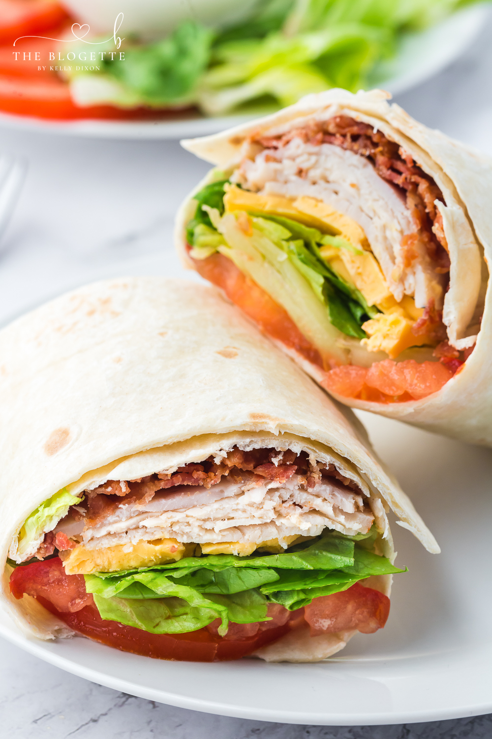 This easy Turkey Ranch Club Wrap is just what your lunch hour needs! Turkey, bacon, and cheese, drizzled with ranch dressing!