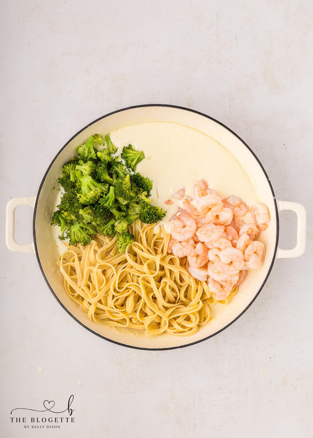 Add the shrimp, cooked fettuccine and broccoli to the pan