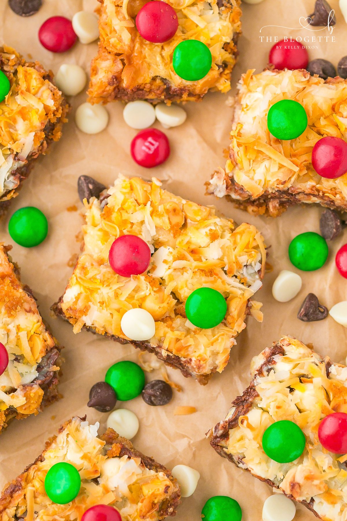 Easy Christmas Magic Bars made with graham crackers, sweetened condensed milk, chocolate chips, coconut, and festive M&M’s. A quick holiday dessert everyone loves!