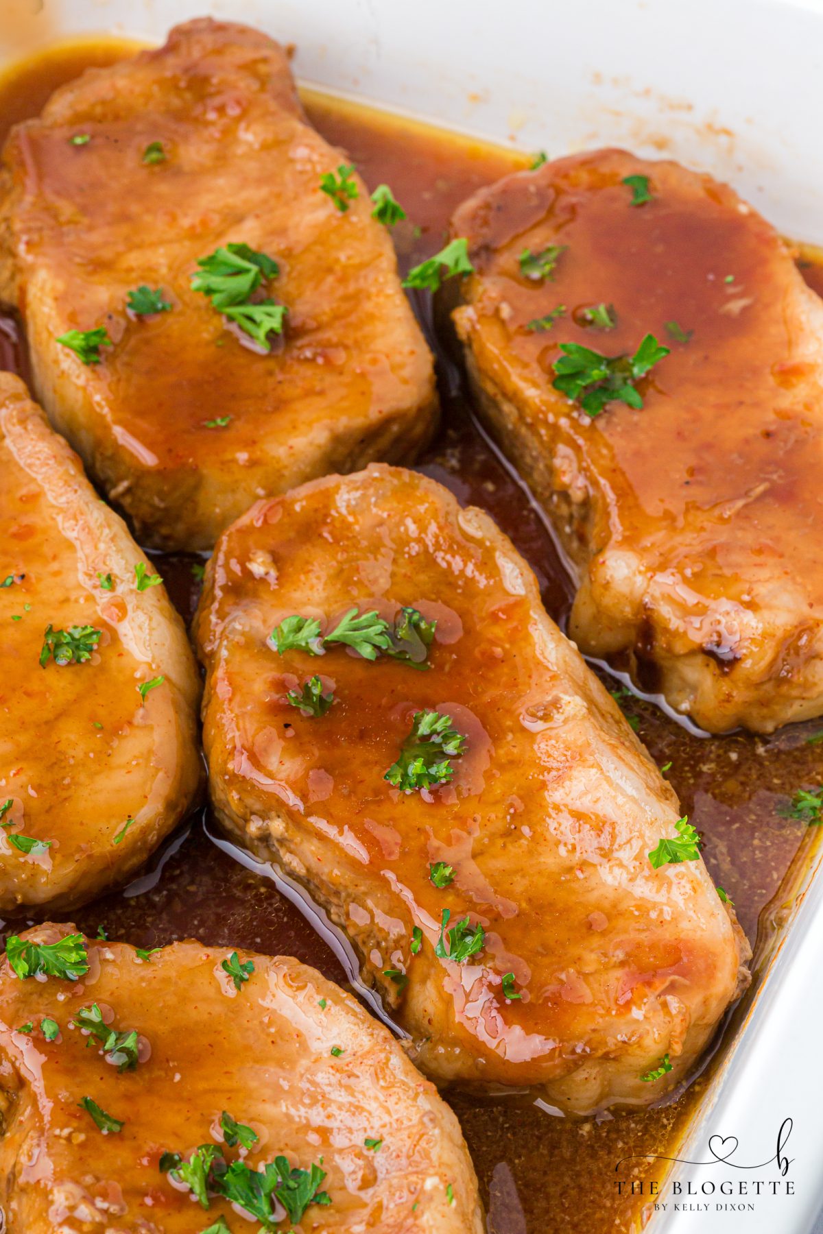 These Brown Sugar Pork Chops are coated in a rich, buttery, sweet-and-savory glaze that bakes into juicy perfection. Easy weeknight recipe with oven and crock pot options! Save this family-favorite pork chop idea for dinner tonight.