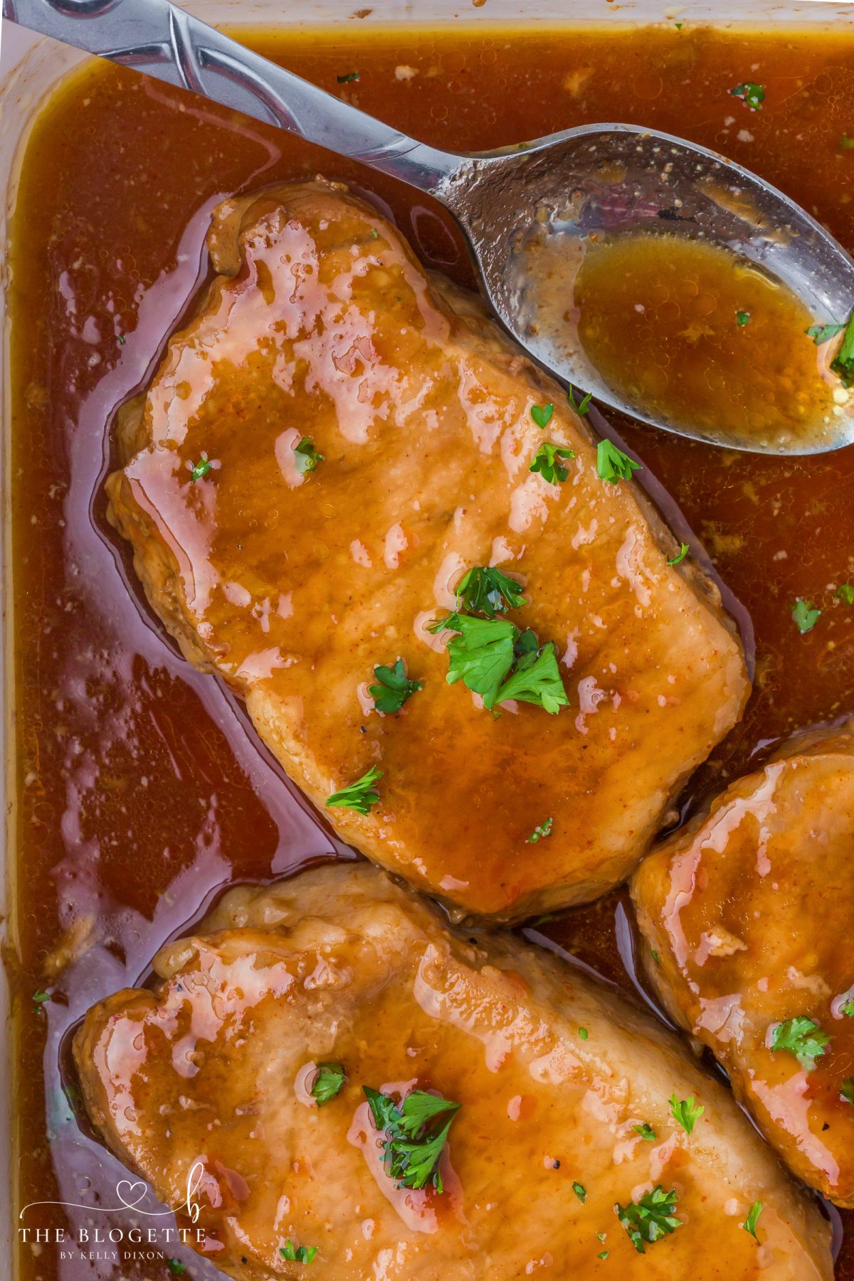 These Brown Sugar Pork Chops are coated in a rich, buttery, sweet-and-savory glaze that bakes into juicy perfection. Easy weeknight recipe with oven and crock pot options! Save this family-favorite pork chop idea for dinner tonight.