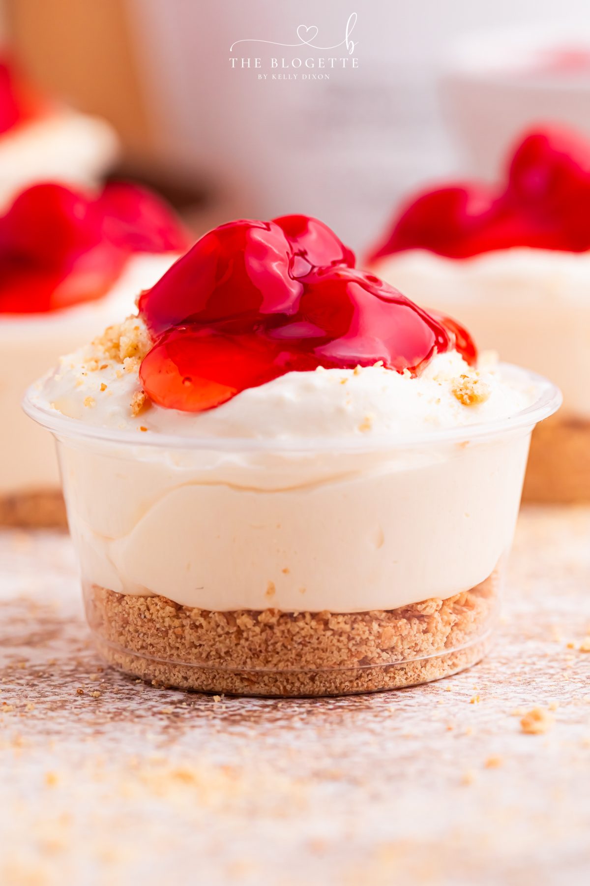 Cherry Cheesecake Shots 🍒✨ The perfect no-bake party dessert! Made with cheesecake pudding, Cool Whip, RumChata, graham crackers, and cherry pie filling. Easy dessert shooters for holidays, girls’ night, brunch, and celebrations. Try this simple make-ahead dessert idea!