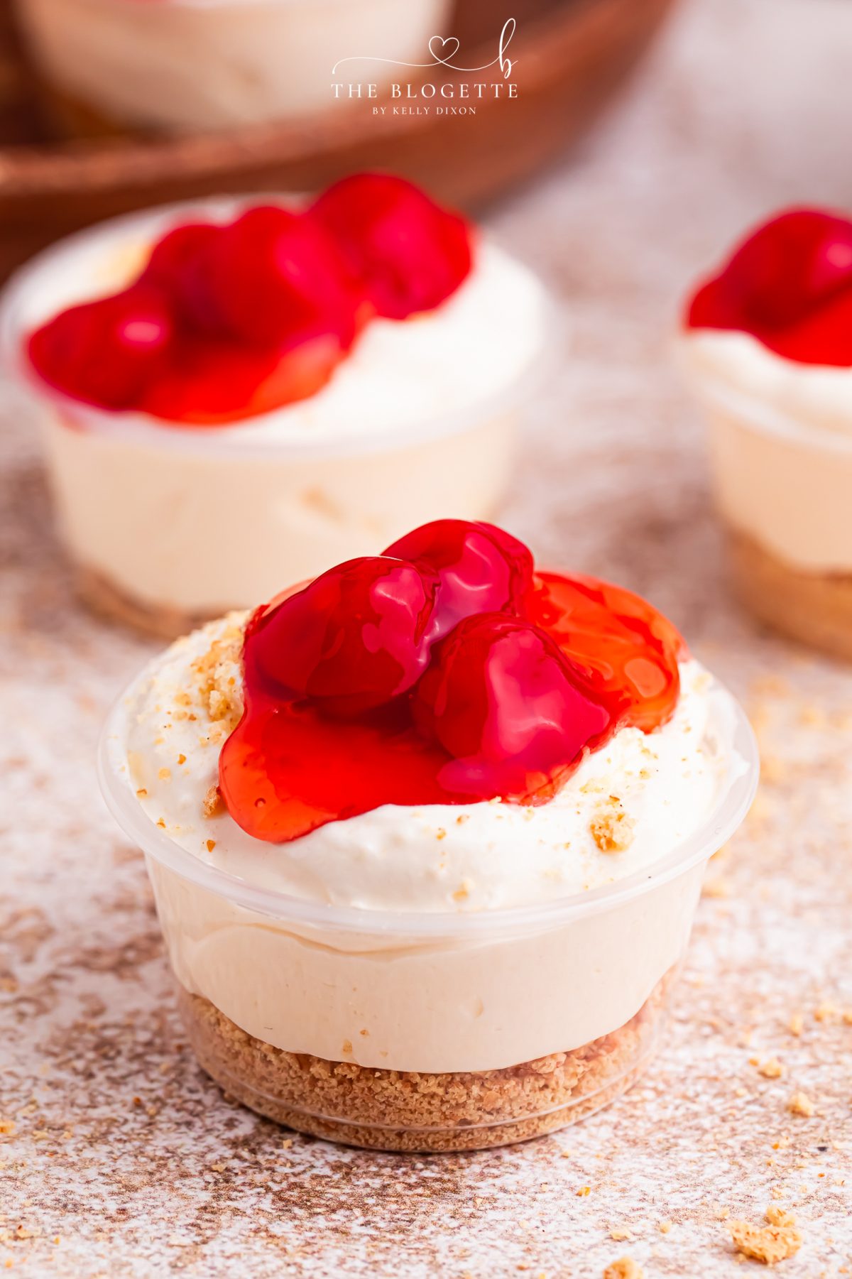Cherry Cheesecake Shots 🍒✨ The perfect no-bake party dessert! Made with cheesecake pudding, Cool Whip, RumChata, graham crackers, and cherry pie filling. Easy dessert shooters for holidays, girls’ night, brunch, and celebrations. Try this simple make-ahead dessert idea!