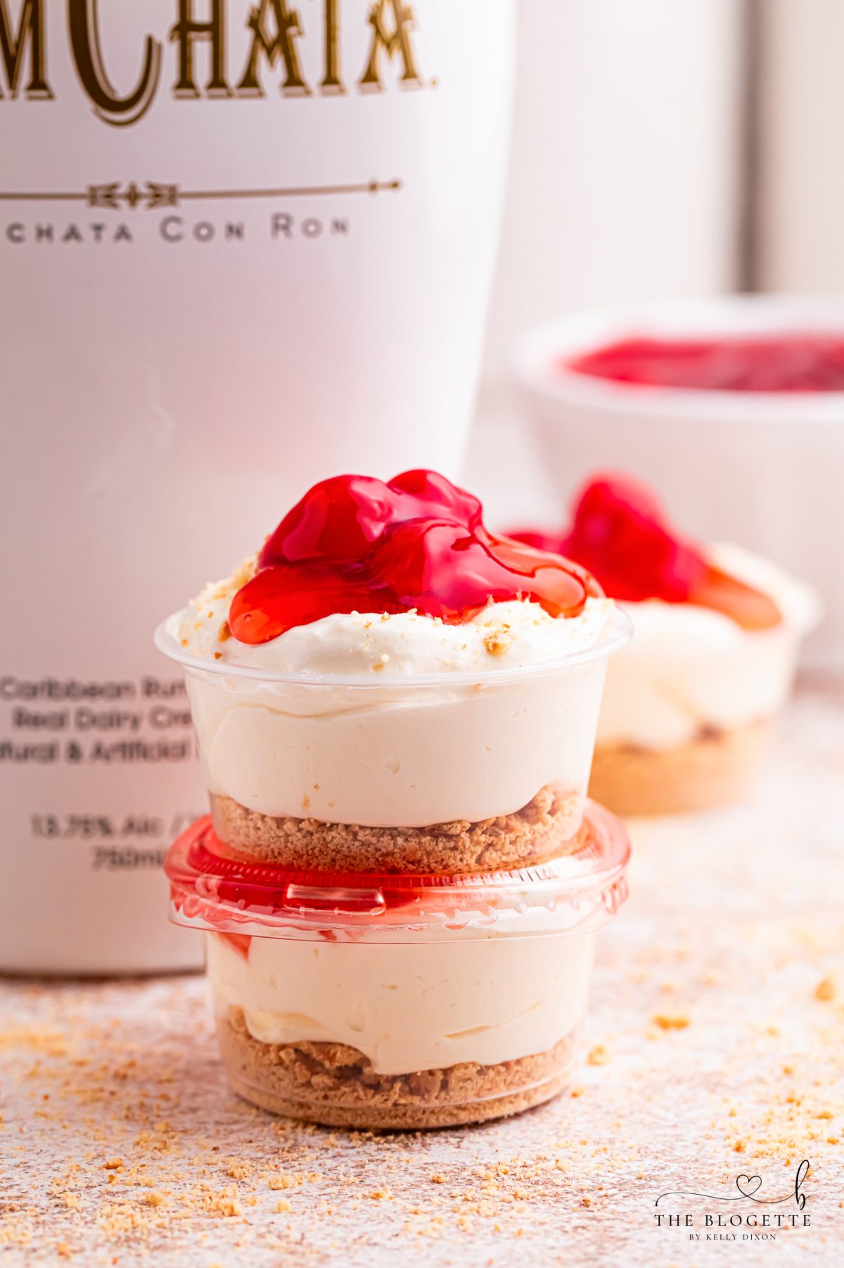 Cherry Cheesecake Shots 🍒✨ The perfect no-bake party dessert! Made with cheesecake pudding, Cool Whip, RumChata, graham crackers, and cherry pie filling. Easy dessert shooters for holidays, girls’ night, brunch, and celebrations. Try this simple make-ahead dessert idea!
