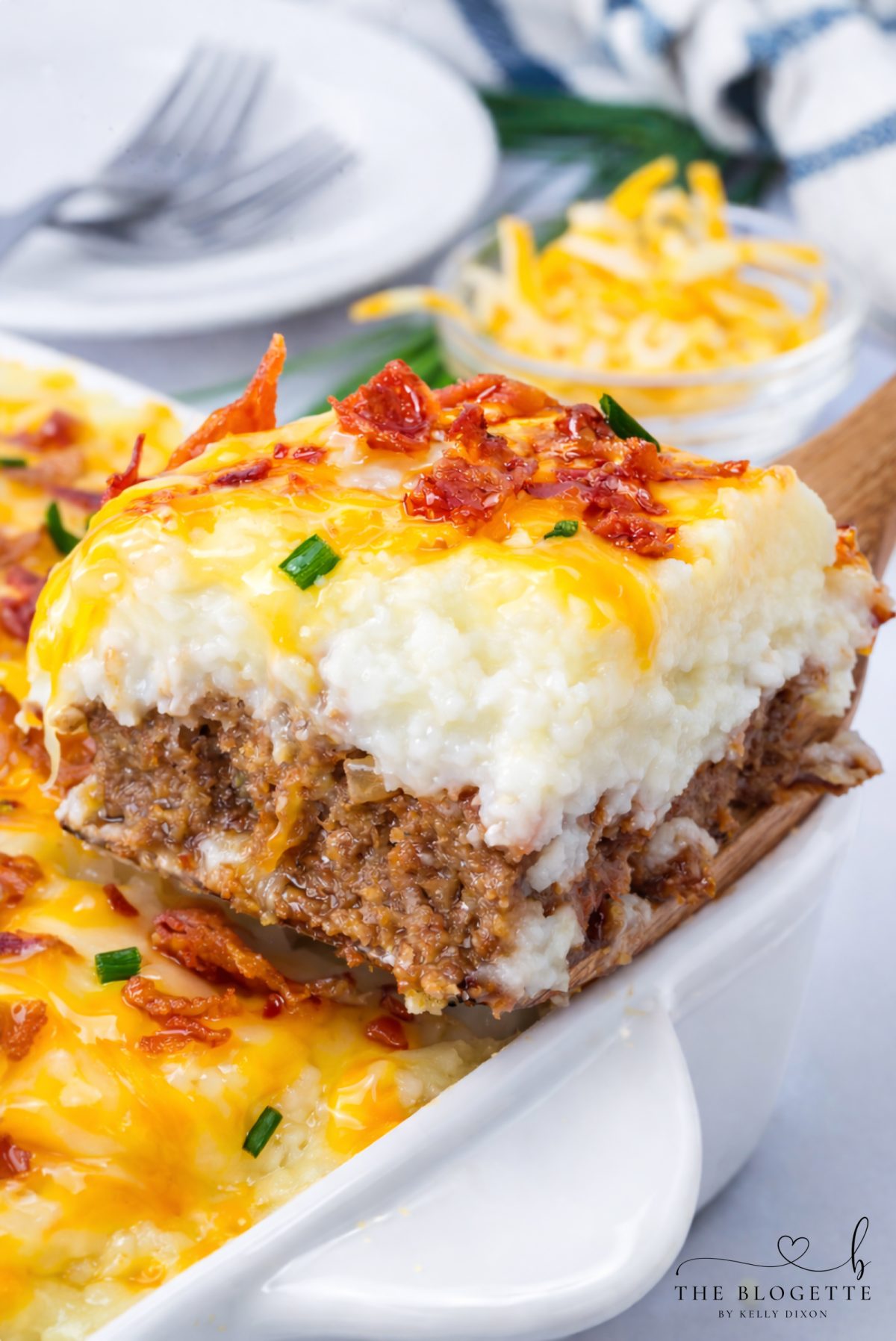 This Loaded Potato Meatloaf Casserole is the ultimate comfort food dinner. Layers of juicy meatloaf, creamy mashed potatoes, melted cheese, and crispy bacon make this easy casserole perfect for family dinners, meal prep, and freezer meals.