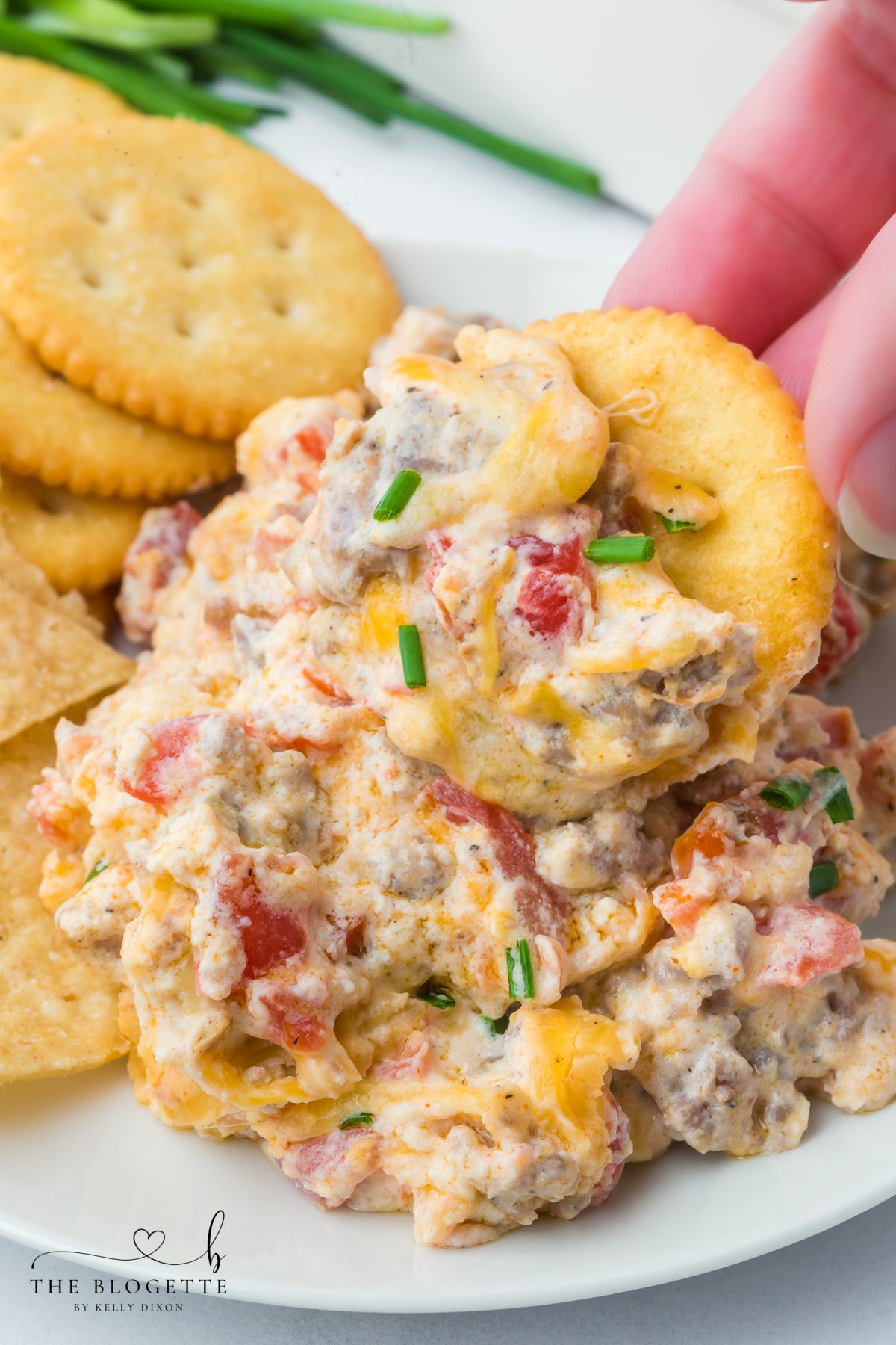 Hissy Fit Dip is the ultimate cheese and sausage dip loaded with cream cheese, Rotel, and melty shredded cheese. This easy appetizer recipe is perfect for game day, parties, and holidays.