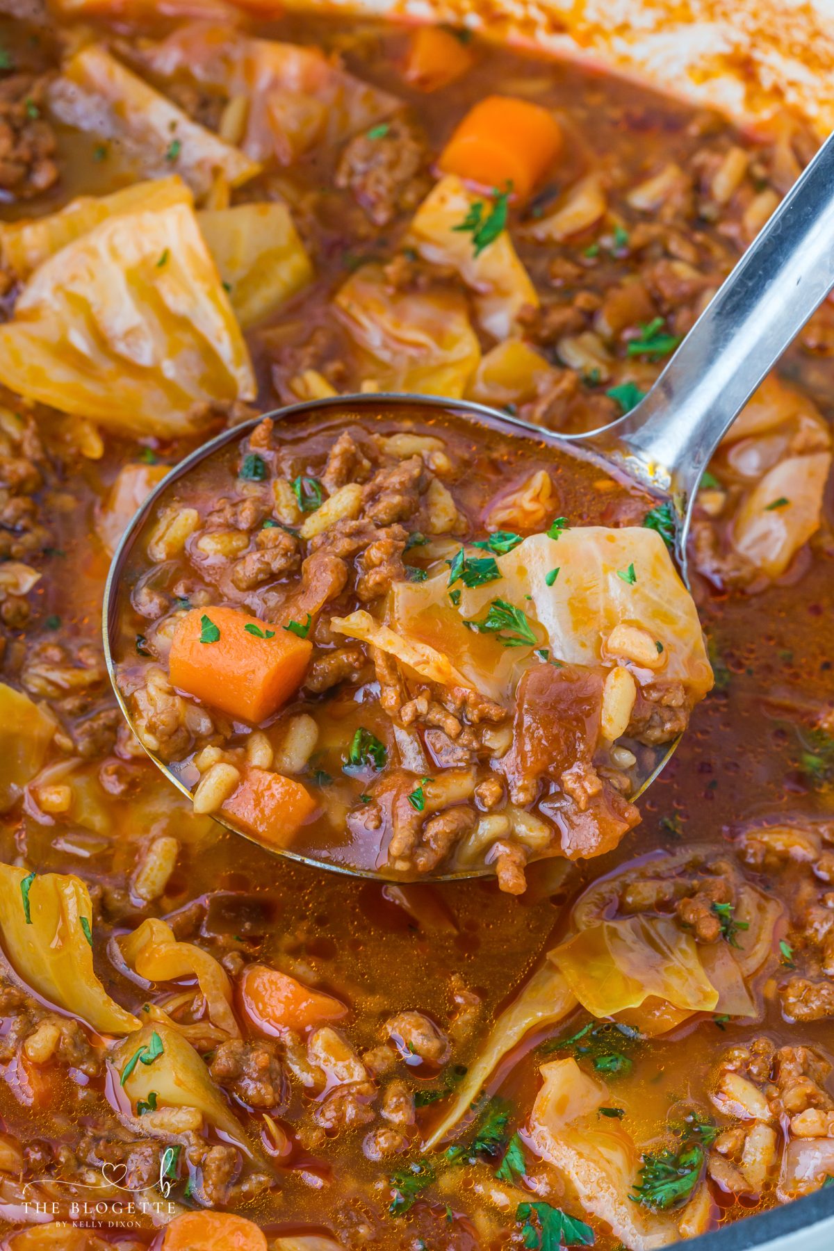 Hearty cabbage soup with ground beef, tender cabbage, tomatoes, and rice simmered in a rich broth. 