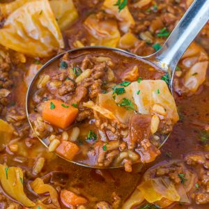 Hearty cabbage soup with ground beef, tender cabbage, tomatoes, and rice simmered in a rich broth.
