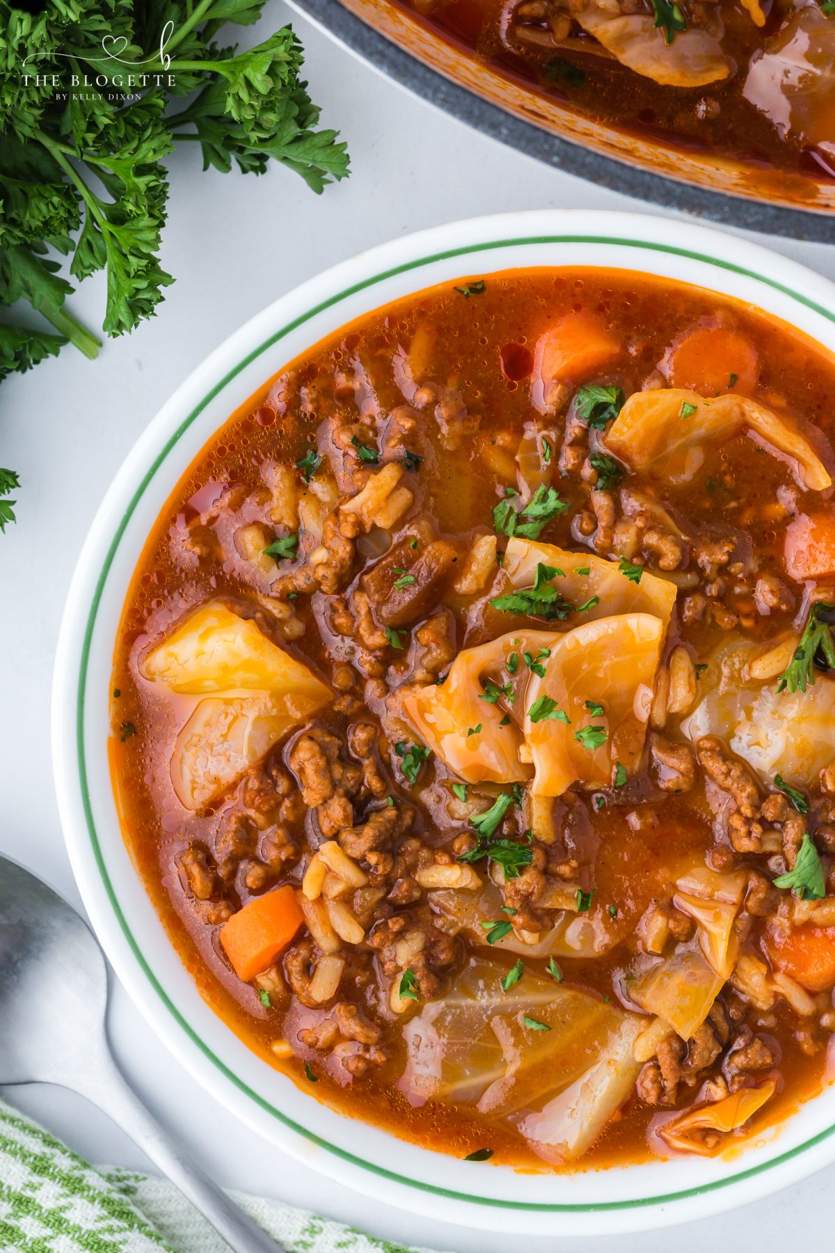Hearty cabbage soup with ground beef, tender cabbage, tomatoes, and rice simmered in a rich broth.