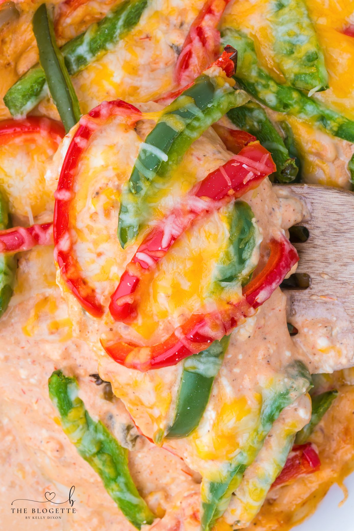 Creamy Chicken Fajita Casserole made with tender chicken, bell peppers, salsa, fajita seasoning, and melted cheese.
