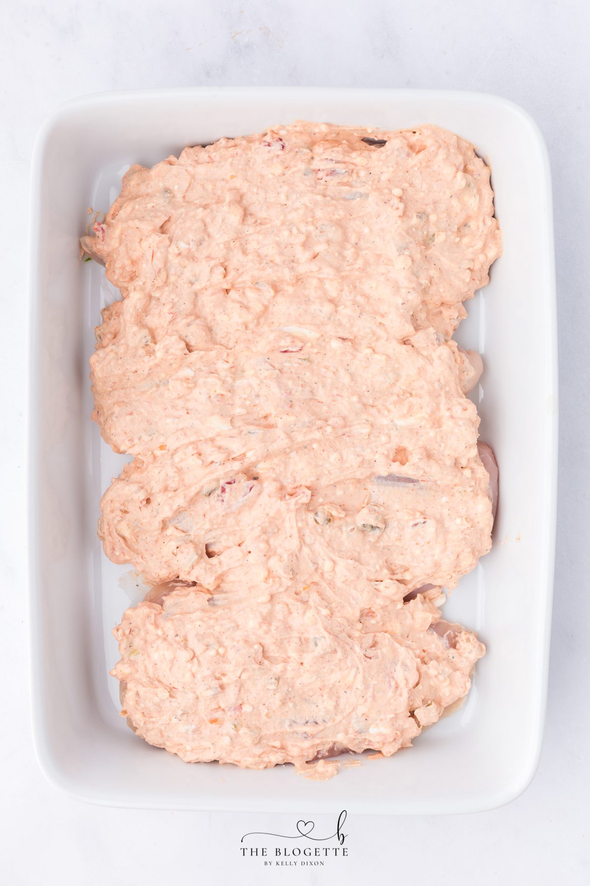 Spread mixture over chicken