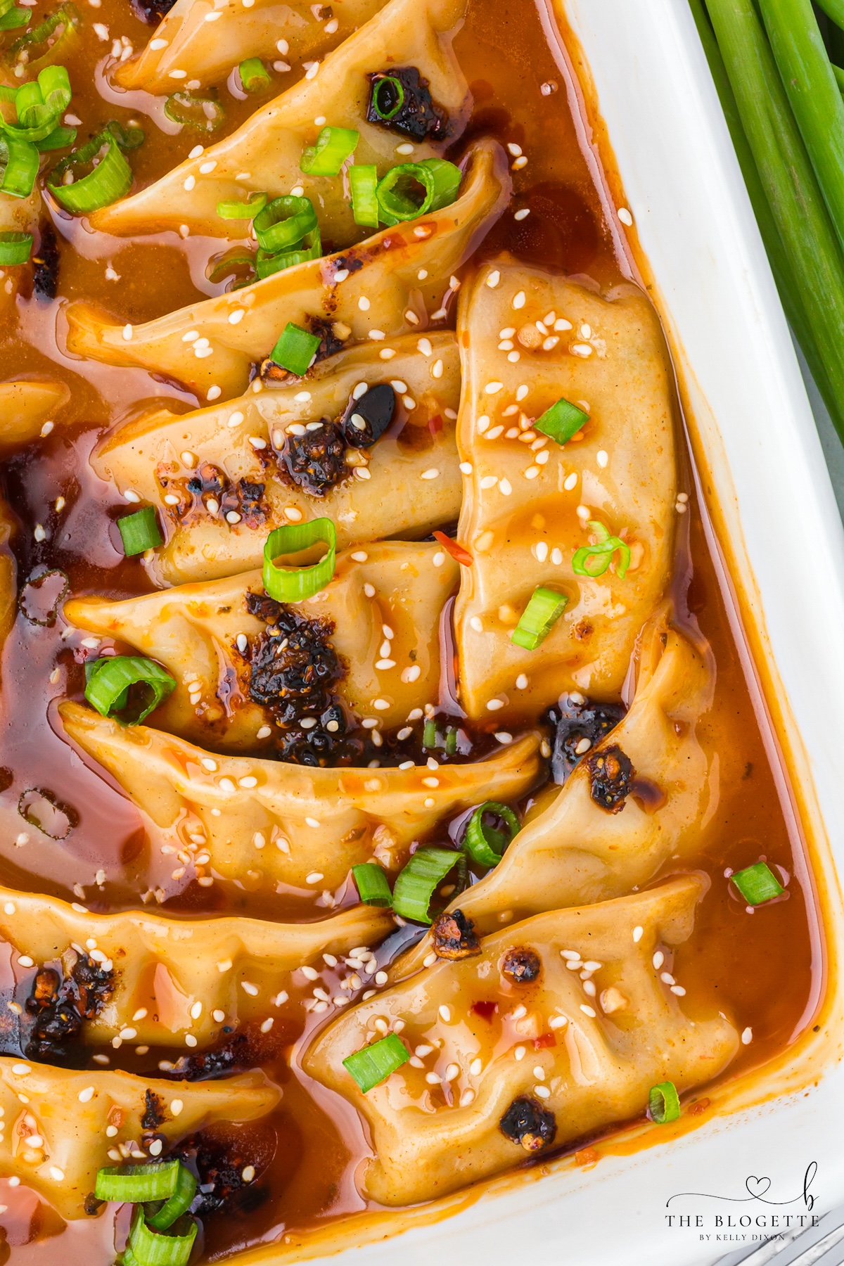 Coconut curry dumpling bake with green onions and sesame seeds