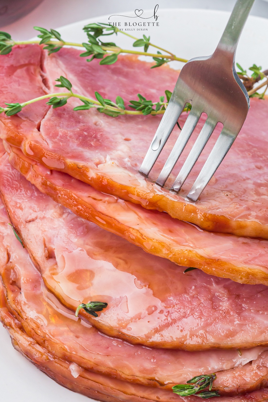 Make tender Crock Pot Ham with a maple brown sugar glaze, pineapple juice, butter, and thyme. An easy holiday ham recipe made in the slow cooker!