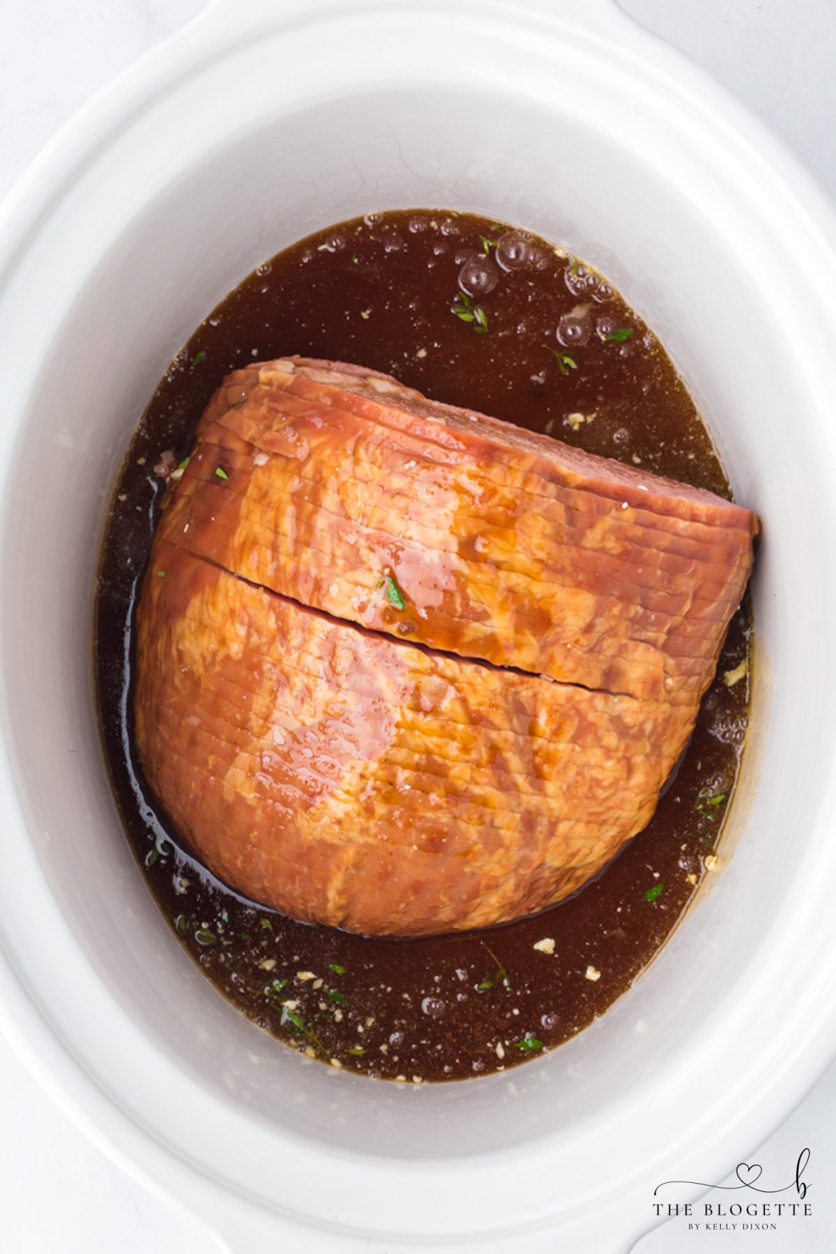 Add sauce over ham in crock pot