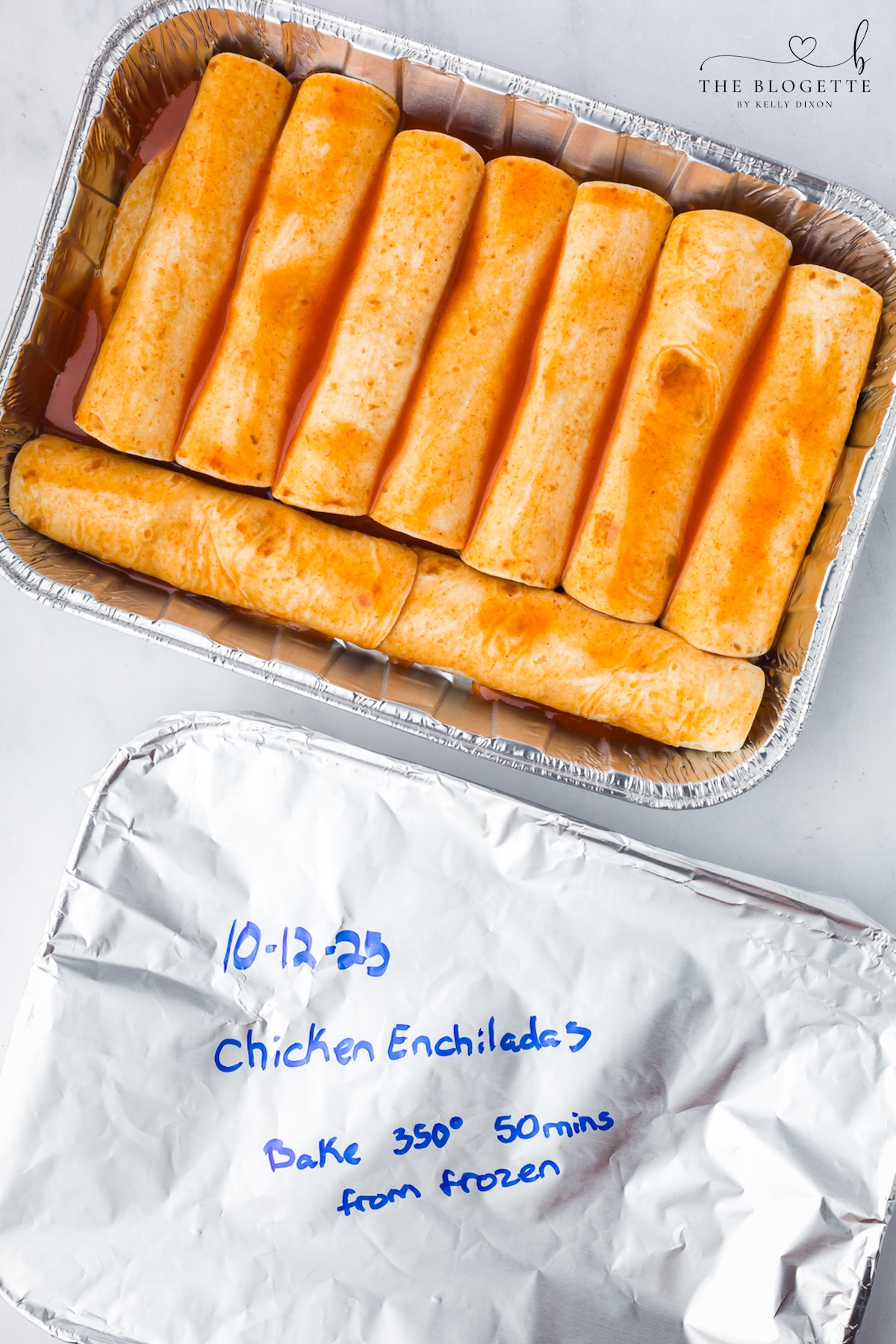 These Freezer Chicken Enchiladas make busy-night dinners so much easier! Crockpot chicken, black beans, green chiles, red enchilada sauce, and plenty of melted cheese come together in a recipe that makes TWO pans. Bake one tonight and freeze one for later!